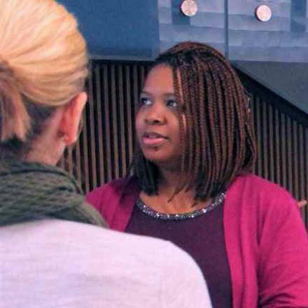 2 People Talking at an event