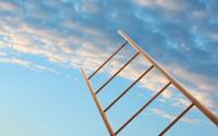 Wooden ladder against blue sky with clouds, low angle view