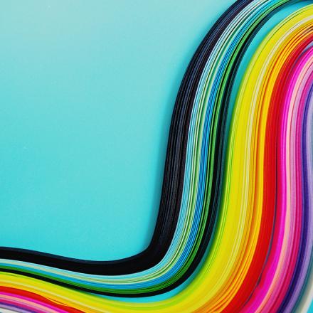 Colorful swirls on the right side of a blue background